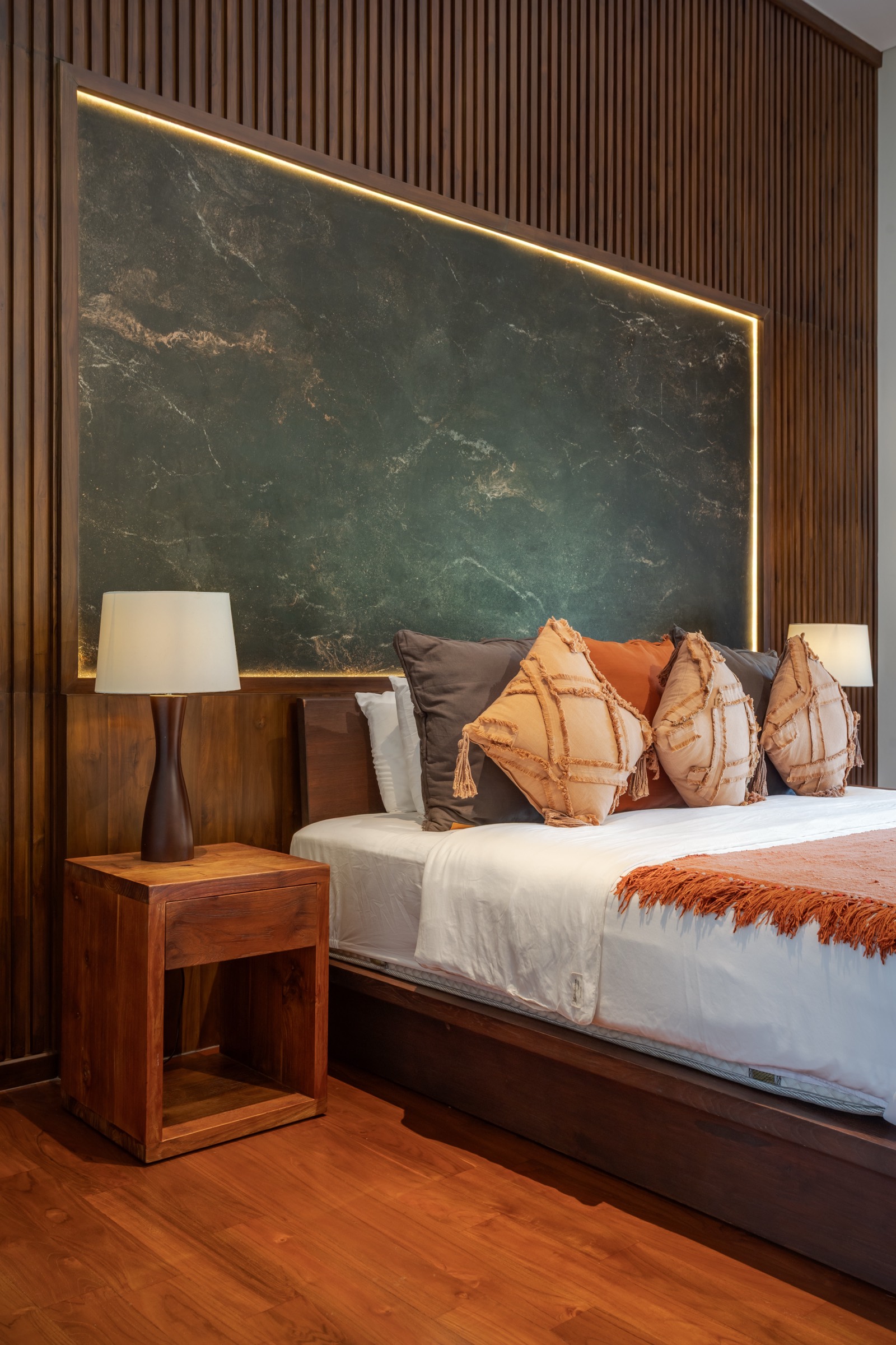 Master bedroom — teak panelling and headboard