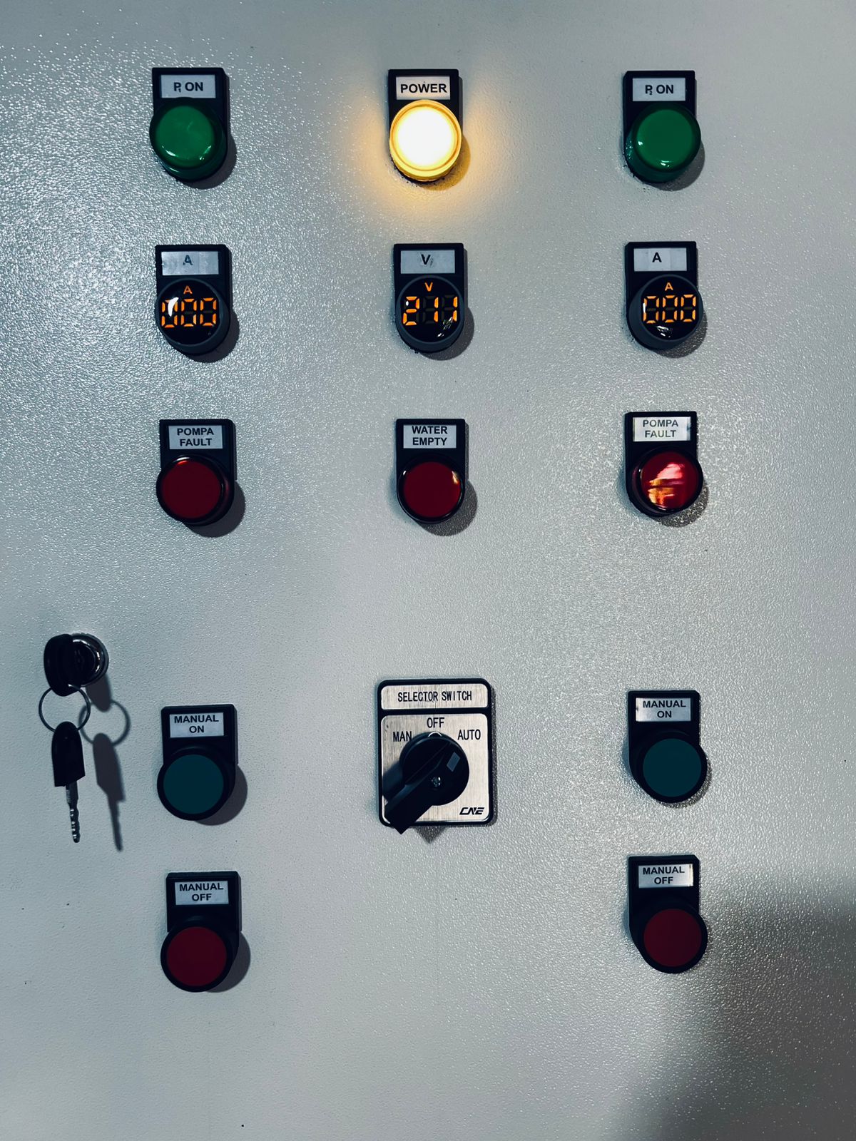 Close-up of booster panel indicator lights and selector switch